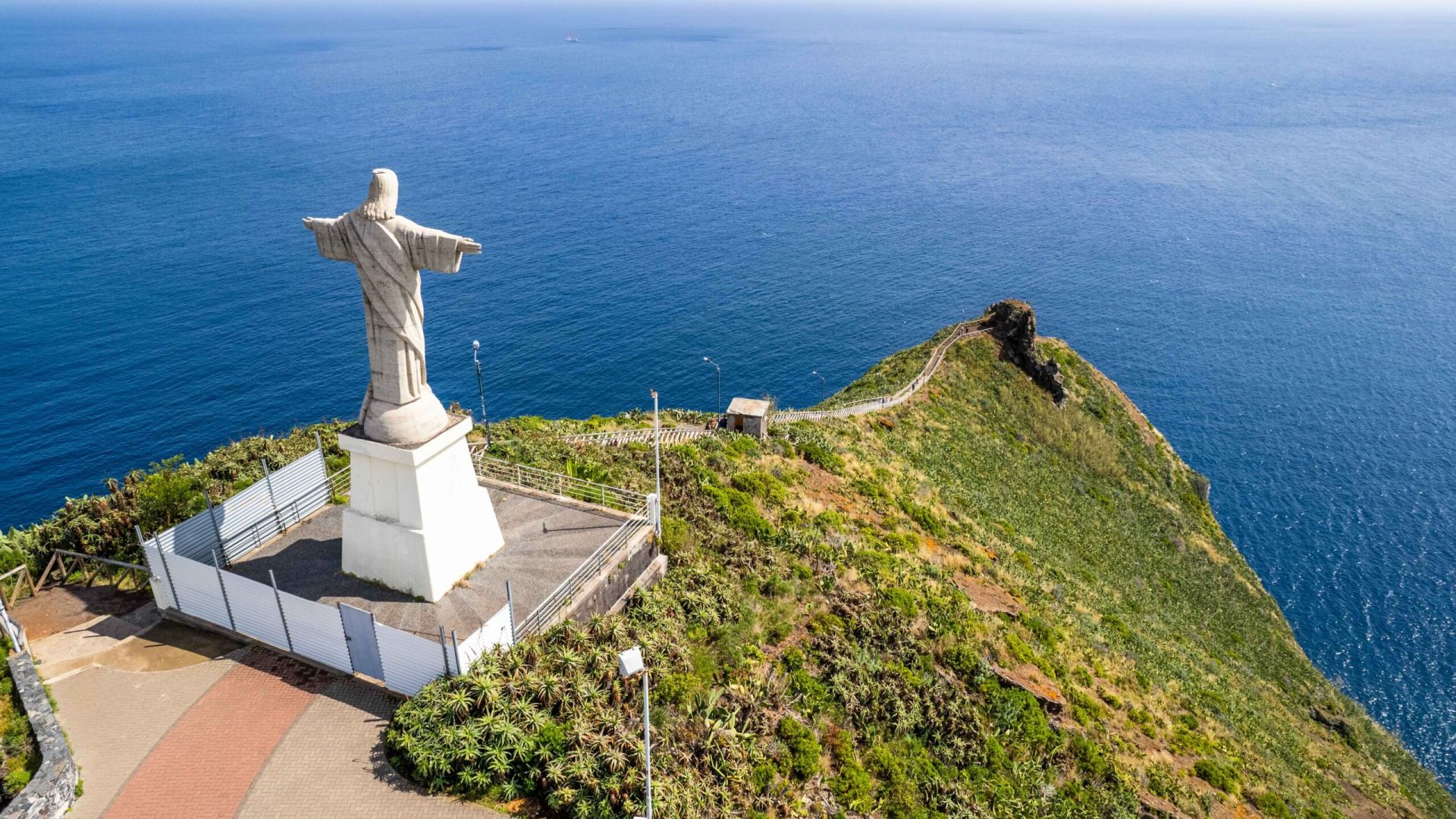Jesus Christ Statue of Christ the King in Garajau (Cristo Rei ) near Funchal. Aerial drone view